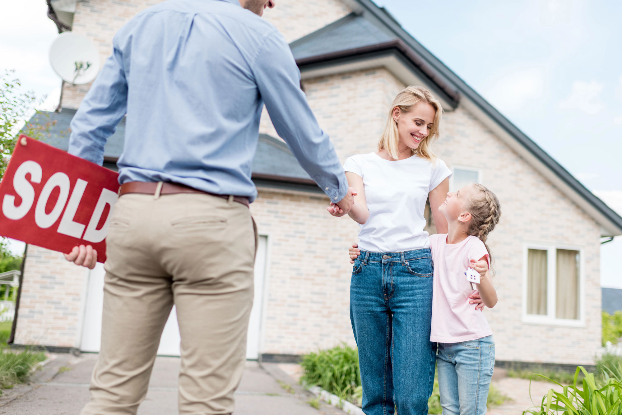 woman and child smiling with Real Estate Lawyer in Queens County, NY