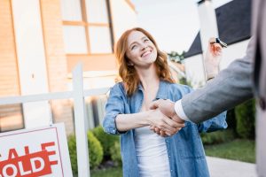 woman shaking hands with Real Estate Attorney and Real Estate Lawyer in Far Rockaway, NY