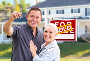 Couple with new keys are home after working with a realtor attorney in Long Island, NY