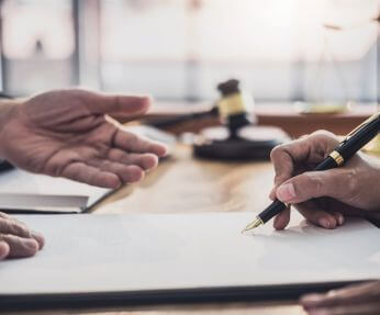 Closing Attorney in Lynbrook, NY Finalizing a Deal with a Client