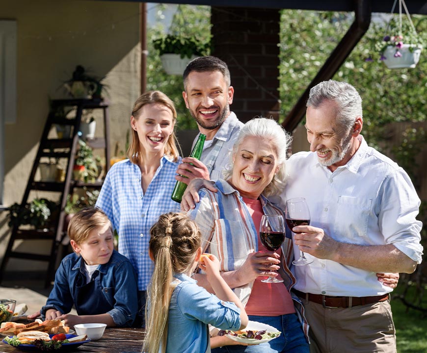 Multigenerational family enjoying dinner after estate planning in Hempstead, NY